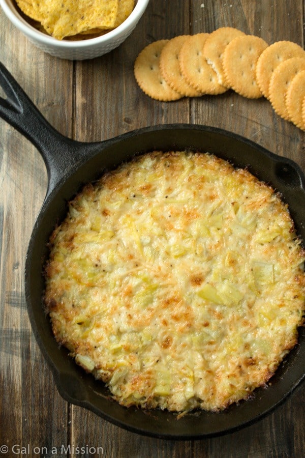 An out-of-this-world delicious hot artichoke dip recipe that is perfect during the holidays or anytime during the year!