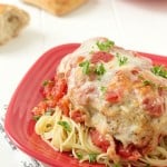 Easy Chicken Parmesan: Moist and juicy chicken breasts coasted in breadcrumbs, mixed with Italian seasonings; then topped with diced tomatoes, Parmesan cheese, and fresh mozzarella.
