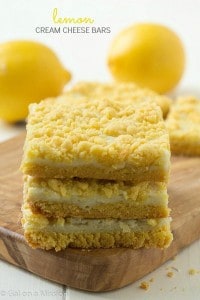 Lemon cream cheese bars: Decadent lemon whipped cream cheese baked between layers of a special ingredient with a delicious streusel lemon topping. A simple and quick dessert bar recipe!