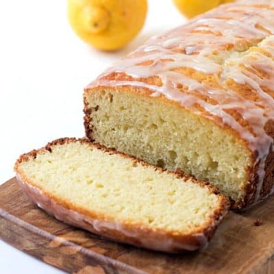 Lemon Yogurt Cake Recipe - Incredibly moist and tender. One bite and it melts-in-your-mouth and you can say it’s finger-licking delicious, too! Everyone all ages loves a lemon cake with lemon icing!