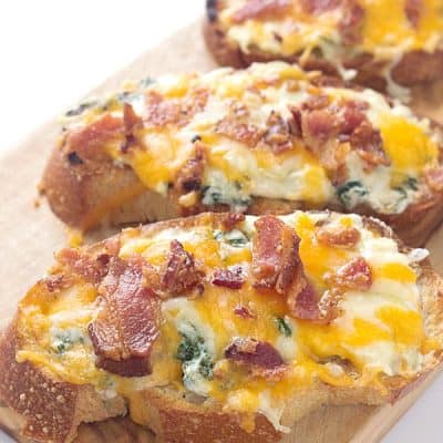 Cheesy Bacon, Kale, Artichoke Crostini - Perfect for a delicious appetizer for your next party or enjoy as a main dish!