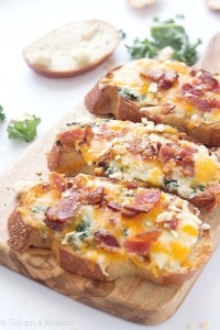 Cheesy Bacon, Kale, Artichoke Crostini - Perfect for a delicious appetizer for your next party or enjoy as a main dish!