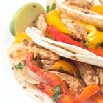 Crock-Pot Pulled Pork Fajitas - Tender pork, shredded and then cooked with a variety of bell peppers and onions! The perfect weeknight or weekend meal!