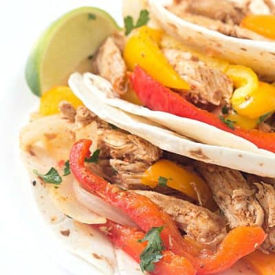 Crock-Pot Pulled Pork Fajitas - Tender pork, shredded and then cooked with a variety of bell peppers and onions! The perfect weeknight or weekend meal!