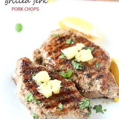 Grilled Jerk Pork Chops - Flavorful and delicious! Perfect as a main entree or on top of a big salad. Best when served with fresh or canned pineapple chunks!