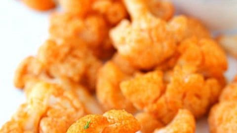 Healthy Buffalo Cauliflower Bites - These bites are addicting, spicy (to some), and surprisingly fantastic! Grab your favorite dip and let's dip in!