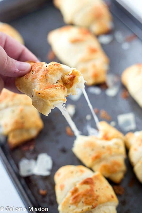 Cheesy Parmesan Crusted Crescent Rolls - Stuffed with mozzarella cheese, then slathered with butter and Italian spices, and then topped with parmesan cheese! Baked to cheesy perfection.