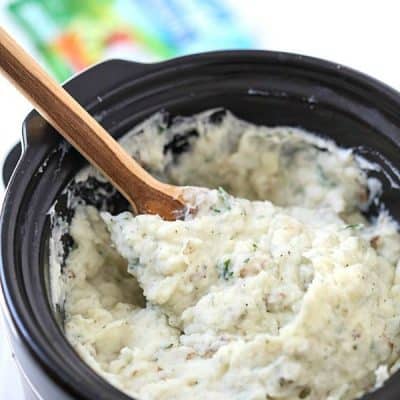 Crock-Pot Ranch Mashed Potatoes - The creamiest and silkiest mashed potatoes ever! We love mashed potatoes with sour cream to create the perfect texture. Mashed potatoes in the crockpot are SO easy!