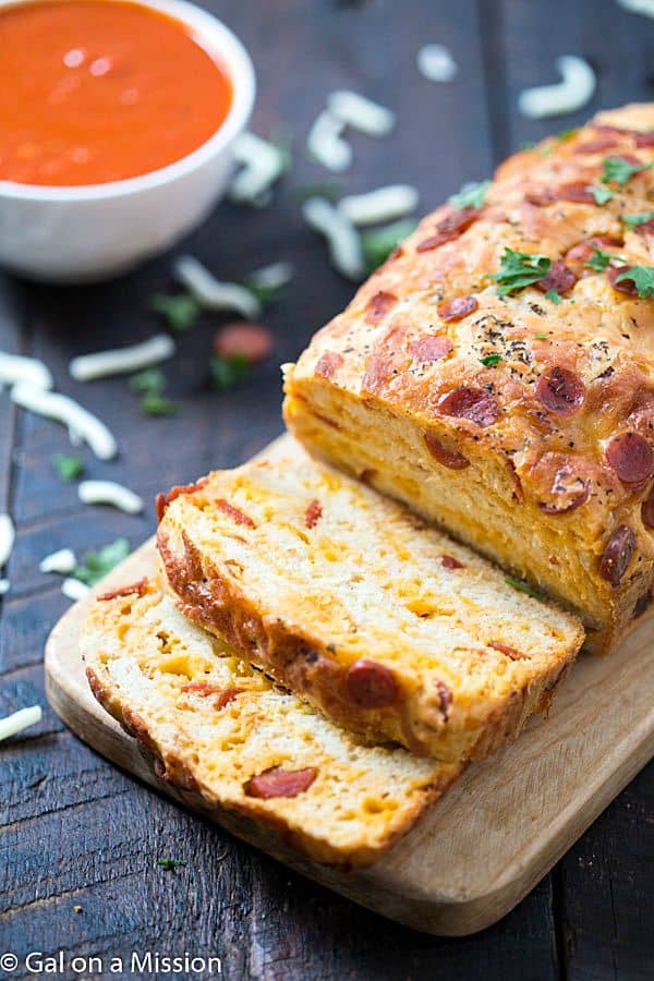 Pepperoni Pizza Quick Bread Recipe - An American favorite stuffed into moist, tender, and flavorful pepperoni pizza quick bread! Ready in no time. Grab the marinara sauce! Move on over pepperoni rolls!