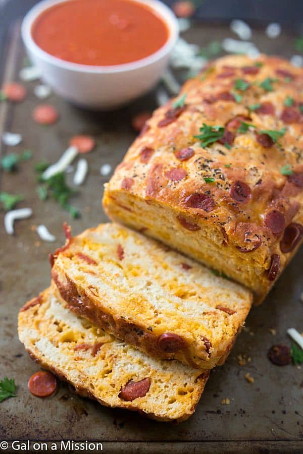 Pepperoni Pizza Quick Bread Recipe - An American favorite stuffed into moist, tender, and flavorful pepperoni pizza quick bread! Ready in no time. Grab the marinara sauce! Move on over pepperoni rolls!