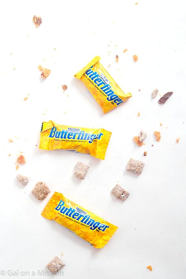 Butterfinger Muddy Buddies - The perfect treat to make any day of the year! So addicting you will not be able to stop.