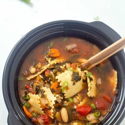 Slow Cooker Ravioli Soup - Loaded with vegetables, cheese-stuffed ravioli! So good, grab a piece of bread and let's dig in!