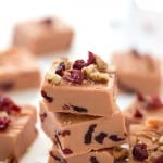 Buttered Rum Fudge with Cranberries - Melts right in your mouth! Dried cranberries scattered throughout each piece, then finished with even more dried cranberries and pecans. Not your momma's kind of fudge! This kind of fudge blows the pants off fudge brownies!