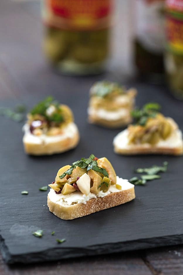 Mixed Olive and Whipped Feta Crostini - An incredibly easy appetizer that will wow your party guests!