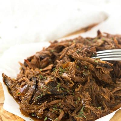 4-Ingredient Slow Cooker Dr. Pepper Pulled Pork - So easy with only five minutes or prep for the most delicious shredded pork! This recipe is ridiculously easy, the ultimate set and forget slow cooker recipe. The leftovers are perfect for tacos, sandwiches, nachos, to name a few of the obvious ones!