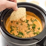 5-Ingredient Slow Cooker Chili Cheese Dip is so much better than the store-bought stuff! This 5-ingredient chili cheese dip has everything any football fan could ever want when the game day munchies kick in!