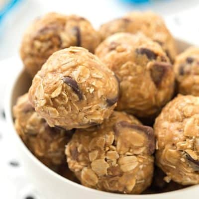 No-Bake Snickers Granola Bites Recipe - So much easier than granola bars! The perfect healthier snack or on-the-go treat made with old-fashioned oats, peanut butter, and honey as the base. Made without flour and white sugar!