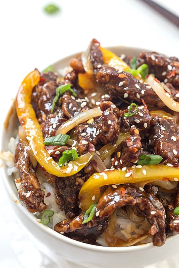 Crispy Spicy Sesame Beef Recipe - Tender and crispy beef stir-fry made with real pantry ingredients! Skip the take-out and made this instead! Add an extra cup of broccoli to make your favorite take-out dish at home!