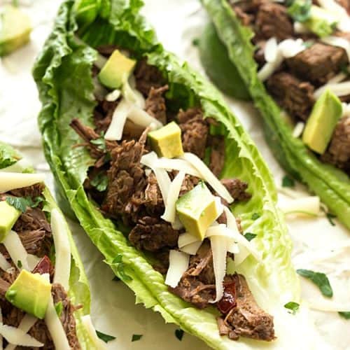 Slow Cooker Barbacoa Taco Lettuce Wraps - Takes 5 minutes to prep in the crockpot and creates the most tender and juiciest homemade barbacoa! Flavored with the traditional barbacoa flavors: garlic, oregano, cumin; including chipotles in adobo! The not historically known authentic recipe, but oh, so delicious!