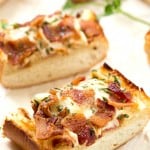Cheesy Bacon Ranch Garlic Bread - Not just another cheesy garlic bread recipe! This bread is fantastic, and we were able to stop eating it! With a few changes, you can have homemade, and this easy garlic bread is taken to a whole new level! The best garlic spread with the addition of ranch seasoning!