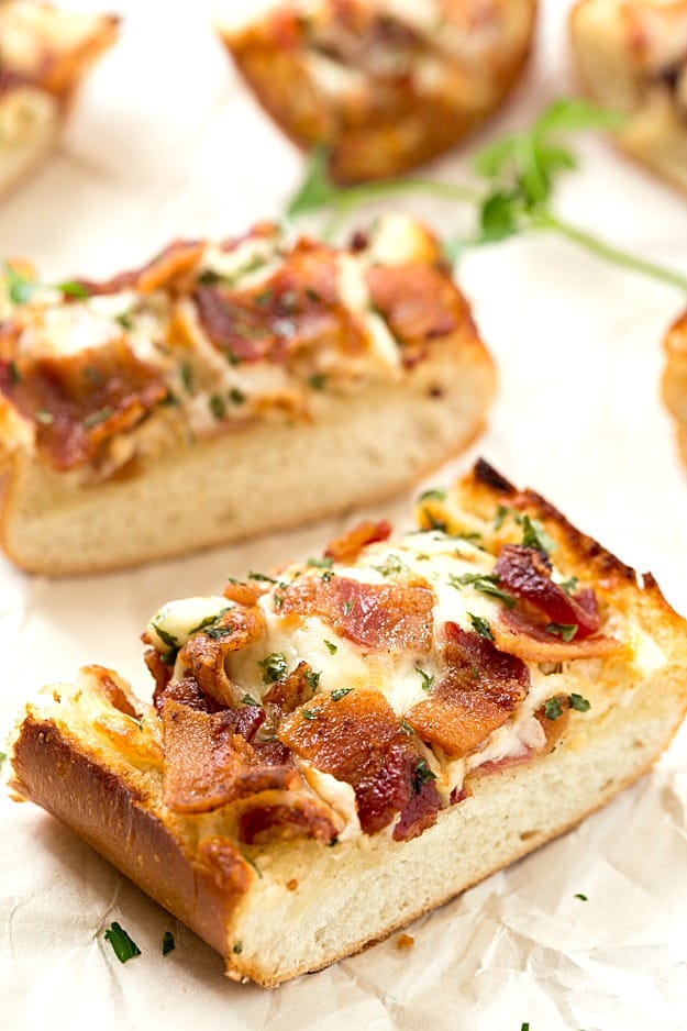 Cheesy Bacon Ranch Garlic Bread - Not just another cheesy garlic bread recipe! This bread is fantastic, and we were able to stop eating it! With a few changes, you can have homemade, and this easy garlic bread is taken to a whole new level! The best garlic spread with the addition of ranch seasoning!