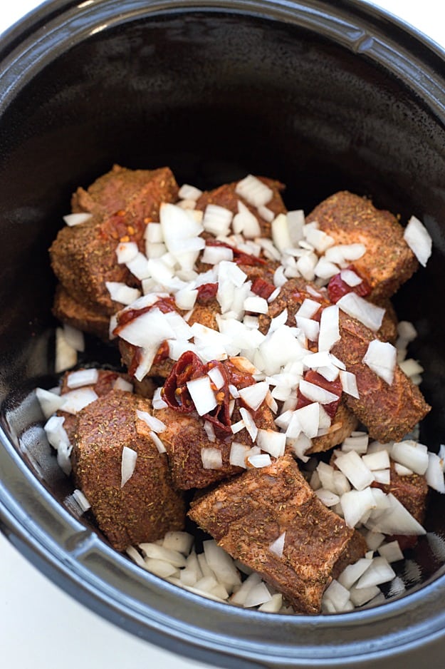 Slow Cooker Barbacoa Taco Lettuce Wraps - Takes 5 minutes to prep in the crockpot and creates the most tender and juiciest homemade barbacoa! Flavored with the traditional barbacoa flavors: garlic, oregano, cumin; including chipotles in adobo! The not historically known authentic recipe, but oh, so delicious! Takes no time to assemble these lettuce wraps. Perfect for a lighter and low-carb option!