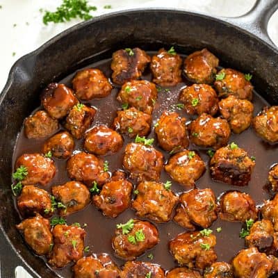 Bacon Honey Bourbon Chicken Meatballs - These meatballs are so easy and bake to perfection, and then simmer in an out-of-this-world honey bourbon barbecue sauce! Perfect as an appetizer or to serve on sandwiches!