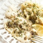 Tilapia & Crockpot Lemon Garlic Mashed Potatoes - An incredibly easy and healthy meal that's no fuss or mess and baked to perfection! Paired perfectly with fresh lemon and garlic flavors! The mashed potatoes can be made with yellow or red potatoes!