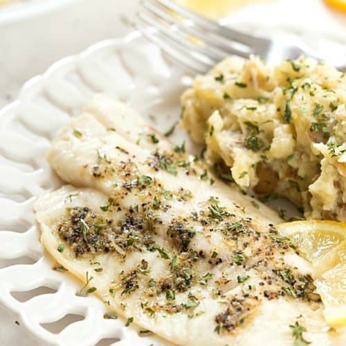 Tilapia & Crockpot Lemon Garlic Mashed Potatoes - An incredibly easy and healthy meal that's no fuss or mess and baked to perfection! Paired perfectly with fresh lemon and garlic flavors! The mashed potatoes can be made with yellow or red potatoes!