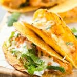 Oven Baked Buffalo Chicken Tacos - These super easy oven baked tacos are loaded with creamy buffalo chicken mixture and then topped with extra shredded cheese! Perfect recipe for taco Tuesday or any day of the week! So much flavor without all of the mess.