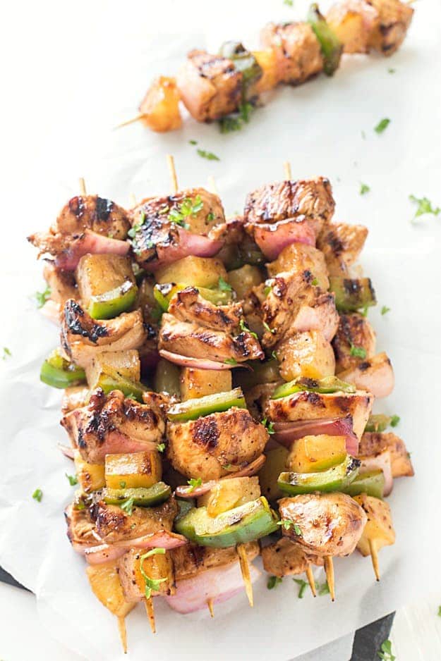 Easy Teriyaki Chicken & Pineapple Kabobs - Dinner cannot get any easier than these grilled kabobs! Packed with flavor from the marinade and threaded onto a skewer with pineapple chunks, red onions, and green bell peppers, then grilled to juicy perfection. By husband LOVED these!