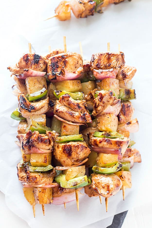 Easy Teriyaki Chicken & Pineapple Kabobs - Dinner cannot get any easier than these grilled kabobs! Packed with flavor from the marinade and threaded onto a skewer with pineapple chunks, red onions, and green bell peppers, then grilled to juicy perfection. By husband LOVED these!