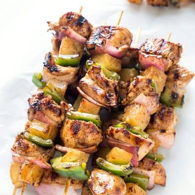 Easy Teriyaki Chicken & Pineapple Kabobs - Dinner cannot get any easier than these grilled kabobs! Packed with flavor from the marinade and threaded onto a skewer with pineapple chunks, red onions, and green bell peppers, then grilled to juicy perfection. By husband LOVED these!