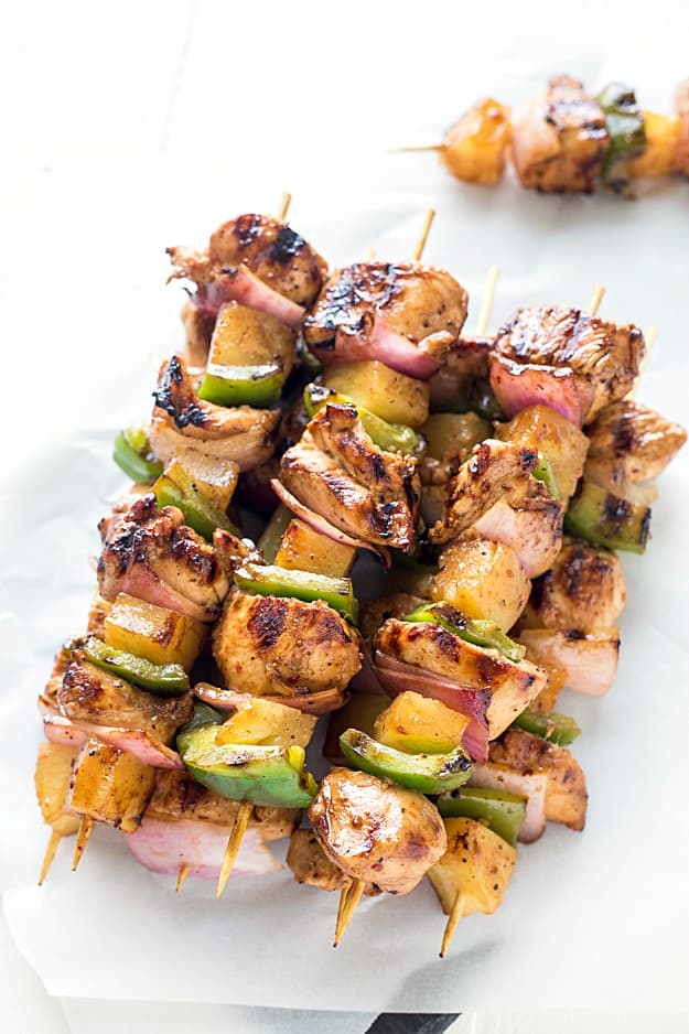 Easy Teriyaki Chicken & Pineapple Kabobs - Dinner cannot get any easier than these grilled kabobs! Packed with flavor from the marinade and threaded onto a skewer with pineapple chunks, red onions, and green bell peppers, then grilled to juicy perfection. By husband LOVED these!