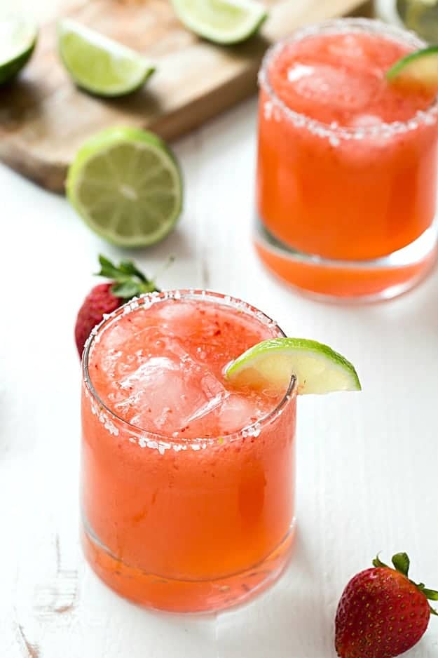 Strawberry Limeade Margaritas - Learn how to make the perfect strawberry limeade margaritas in no time! If you love classic margaritas or even frozen margaritas, you are going to love these! Sweet, tart, and refreshing!