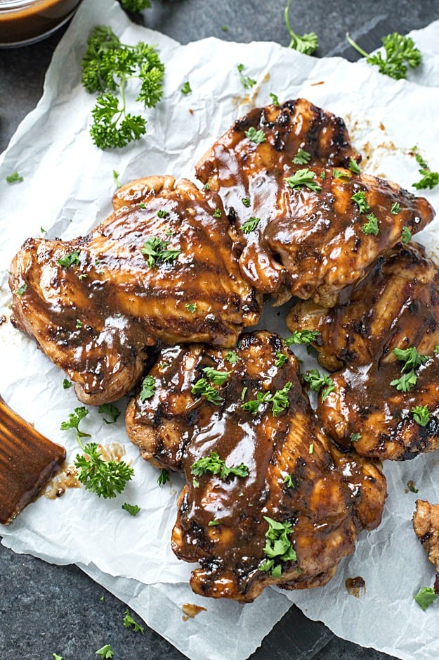 Sweet Honey BBQ Grilled Chicken - The juiciest and easiest grilled chicken thighs. Add a side for a complete meal or it instantly transforms sandwiches, salads, tacos, you name it into the most flavor bursting meal! A staple during grilling season!