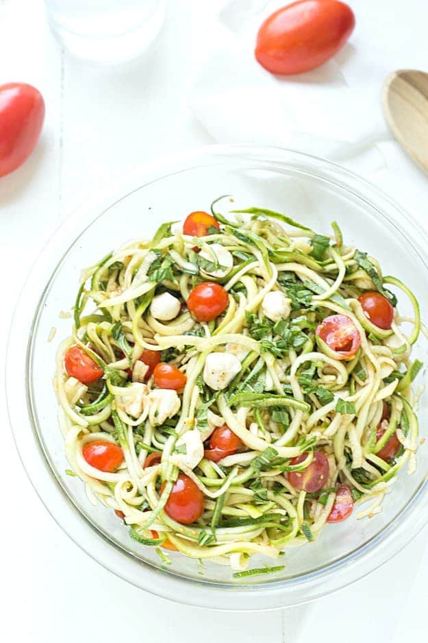 Simple Caprese Zucchini Summer "Pasta" Salad - This Caprese pasta salad couldn't be any easier! The perfect summer salad and great as an appetizer or a side salad. Take it to your next potluck or BBQ and wow your guests! Low carb and keto-friendly!