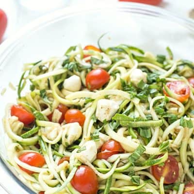 Simple Caprese Zucchini Summer "Pasta" Salad - This Caprese pasta salad couldn't be any easier! The perfect summer salad and great as an appetizer or a side salad. Take it to your next potluck or BBQ and wow your guests! Low carb and keto-friendly!