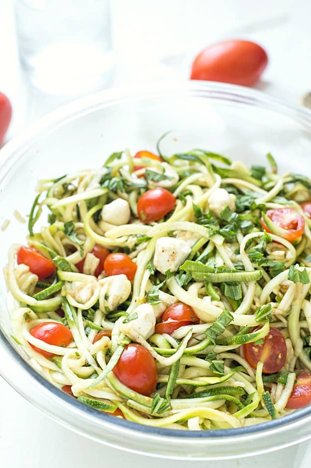 Simple Caprese Zucchini Summer "Pasta" Salad - This Caprese pasta salad couldn't be any easier! The perfect summer salad and great as an appetizer or a side salad. Take it to your next potluck or BBQ and wow your guests! Low carb and keto-friendly!