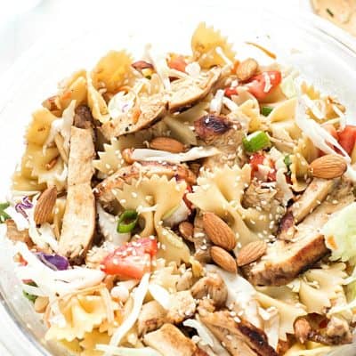 Asian Chicken Pasta Salad - Made with an incredible vinaigrette and simple ingredients! Ready to go in 15 minutes and can be made with or without mandarin oranges. Perfect for picnics and potlucks.