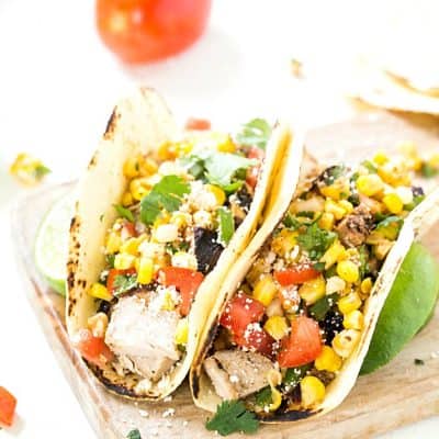 Grilled Pork Tacos with Mexican Corn Salsa - Pork tenderloin marinated to perfect and smothered with an incredible Mexican corn salsa. The corn salsa is so good you may even spoon it directly into your mouth! Everyday of the week easy!