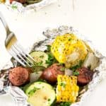 Kielbasa Sausage & Grilled Vegetables in Foil - These foil packets are so quick to assemble! Perfect for camping or a quick dinner. Packed with sausage, zucchini, and corn with the most amazing seasoning! A family favorite any night of the week.