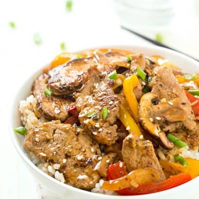 Quick and Easy Pork Stir Fry - Tender slices of marinated pork sauteed with colorful bell peppers, mushrooms, and onions, then coated in a quick and easy homemade sauce! Ready and on the table in under 30 minutes!