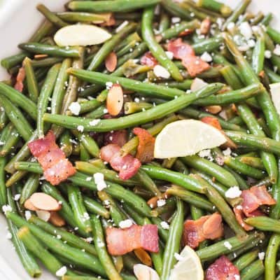 Lemon Butter Green Beans with Toasted Almonds Bacon & Feta - Fresh green beans coated in the most outrageous lemon butter sauce! They are salty, tangy, crunchy, and crispy! AKA the best green beans ever!