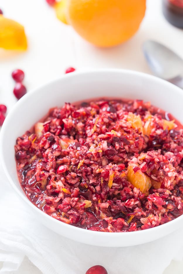 This sweet, but tart Cranberry Orange Relish Recipe is so easy and perfect for the holidays! Take a break from your traditionally served cranberry sauce and make this fresh relish instead.