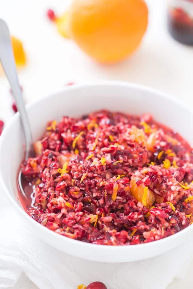 This sweet, but tart Cranberry Orange Relish Recipe is so easy and perfect for the holidays! Take a break from your traditionally served cranberry sauce and make this fresh relish instead.