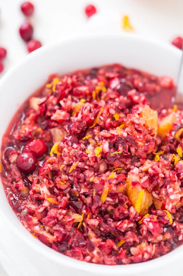 This sweet, but tart Cranberry Orange Relish Recipe is so easy and perfect for the holidays! Take a break from your traditionally served cranberry sauce and make this fresh relish instead.