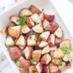 These easy Garlic Roasted Red Potatoes are full of flavor! They are crispy on the outside and oh, so tender on the inside - my favorite. Oven-roasted potatoes are a must-have for any meal!