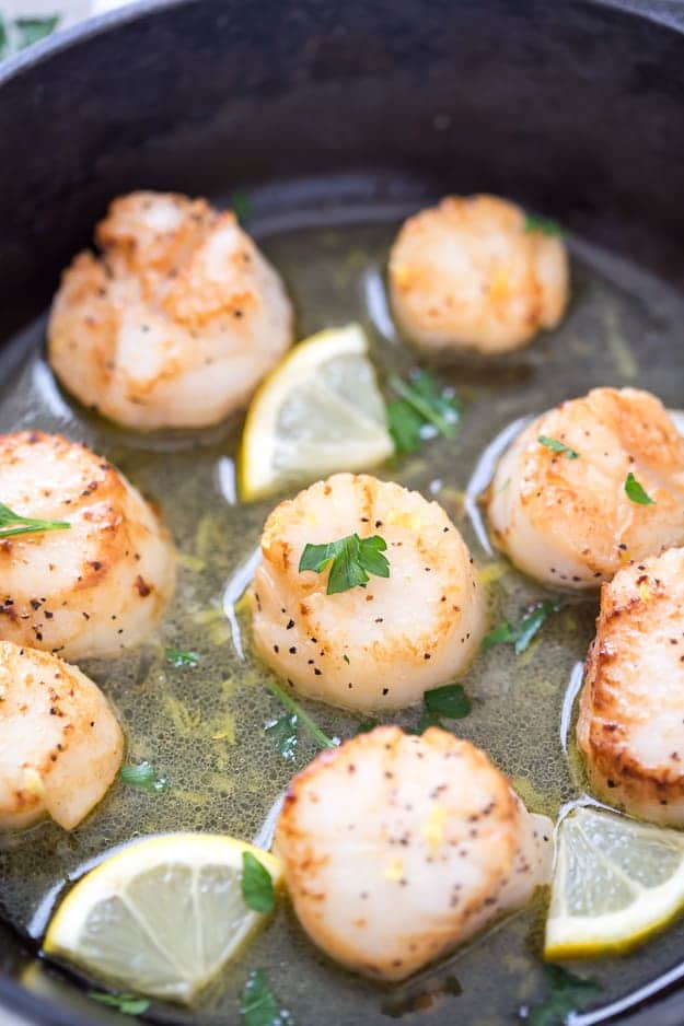 Lemon Garlic Scallops with Black Truffle Sea Salt are seared to perfection! These are the easiest and tastiest scallops you will ever make. Make restaurant-quality scallops in your own kitchen!