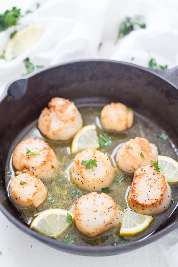 Lemon Garlic Scallops with Black Truffle Sea Salt are seared to perfection! These are the easiest and tastiest scallops you will ever make. Make restaurant-quality scallops in your own kitchen!